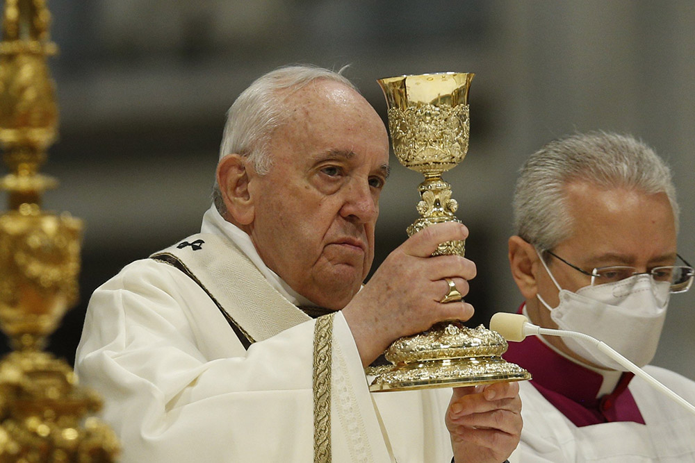 Pope Francis celebrates the Eucharist during Holy Thursday chrism Mass in St. Peter's Basilica at the Vatican April 14. (CNS/Paul Haring)